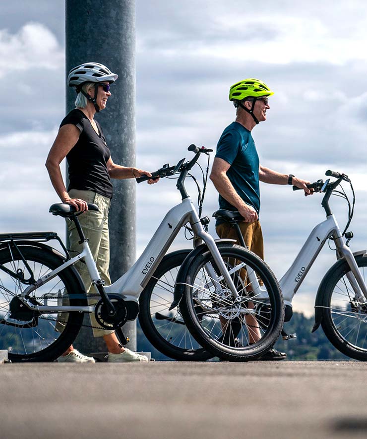 People Standing Next to Electric Bikes